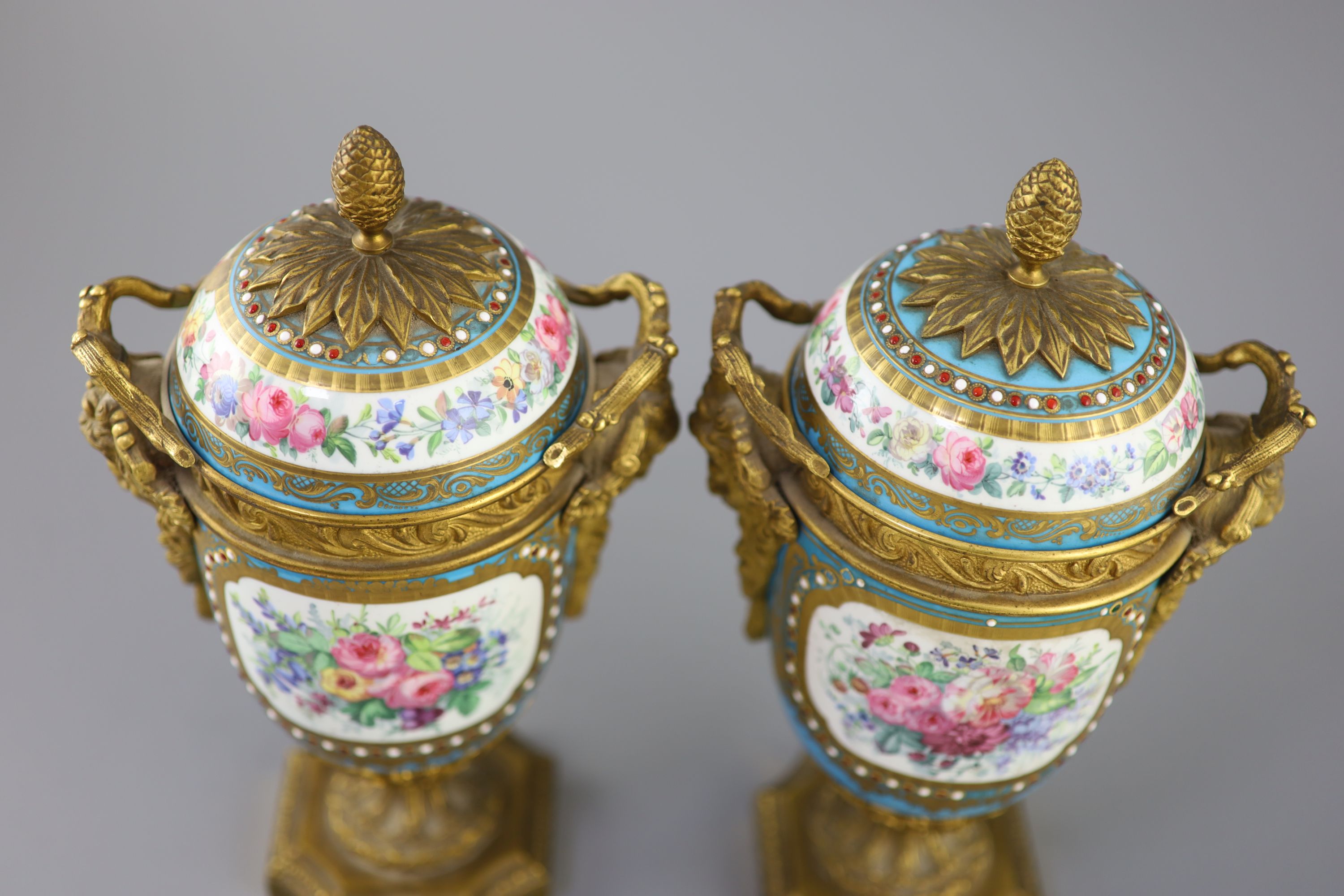 A pair of French Sevres style porcelain and ormolu mounted vases and covers, 19th century, 27cm high